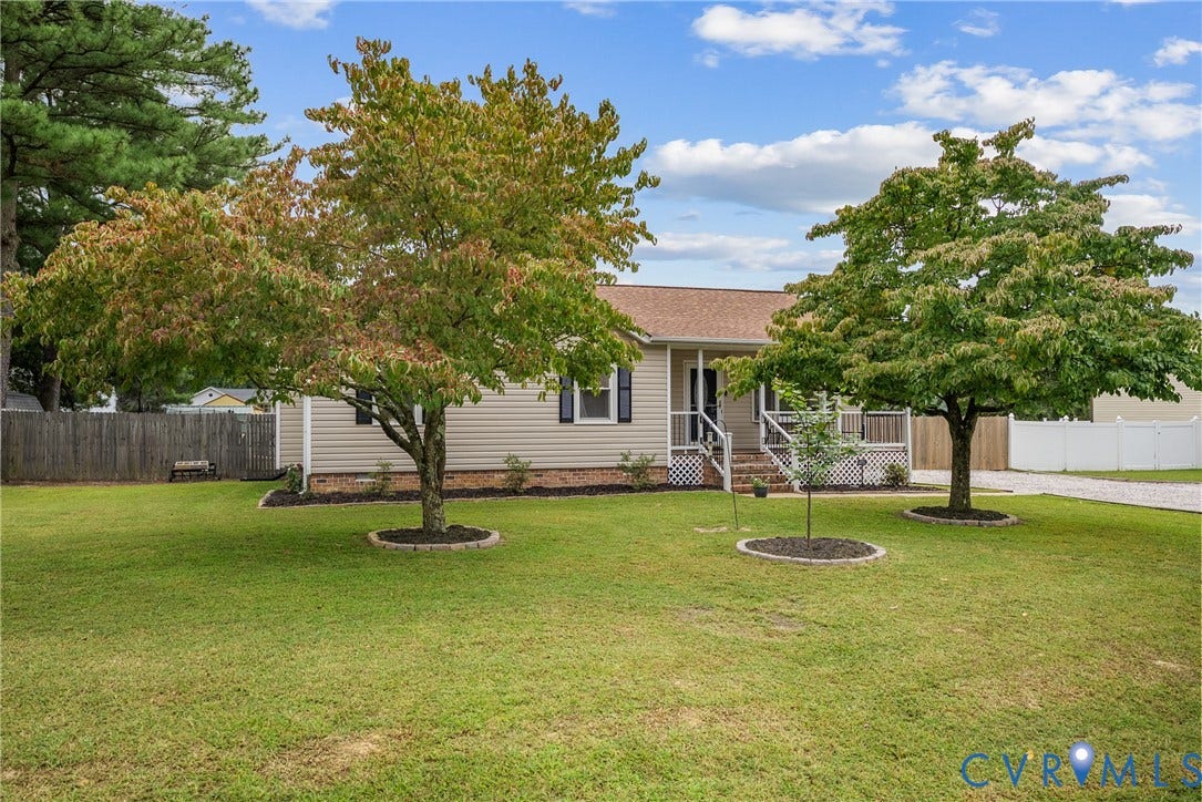 Siding exterior with a covered porch entry
