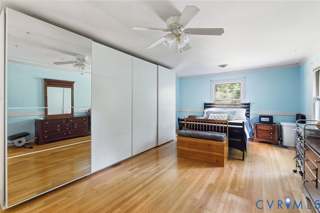 Primary bedroom has a walk in closet and built in custom closets.