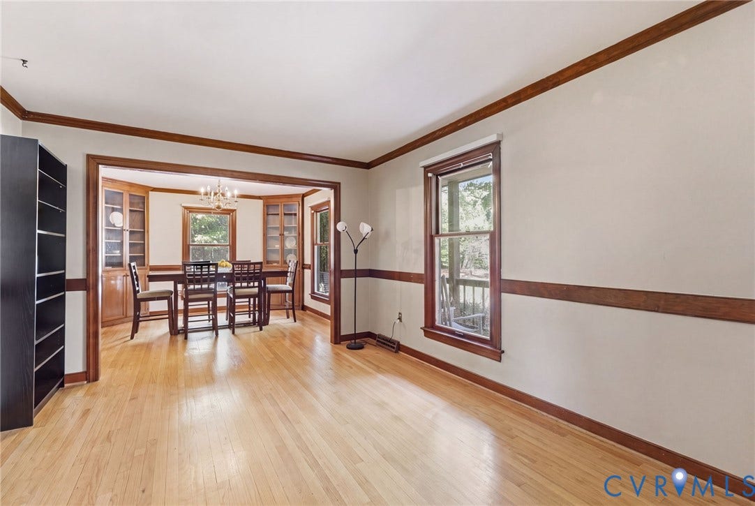 Great flow from the living room to the wonderful dining room with built-in corner hutches.
