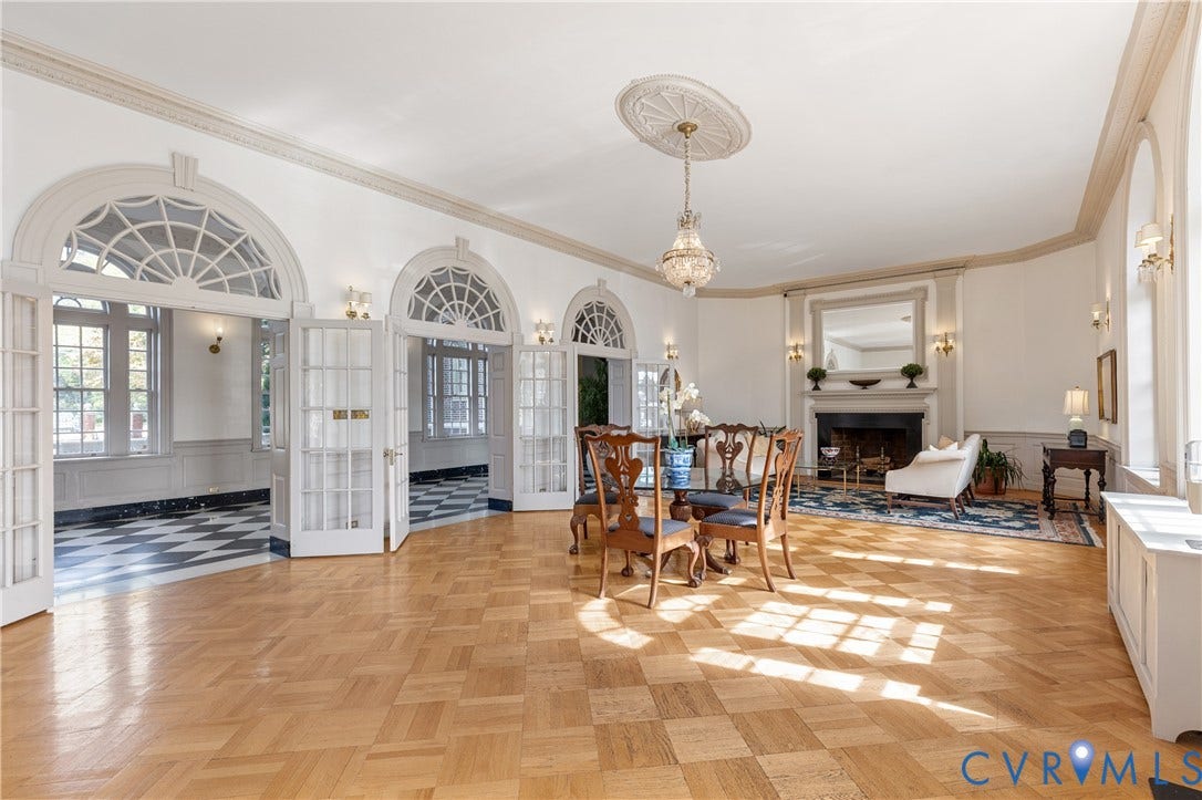5621 Cary Street Road, #U4, Wilton, Richmond, VA 23226 Parquet hardwood flooring, arched glass-paneled double doors with transom windows, crown molding, fireplace with mantel, and a decorative ceiling medallion