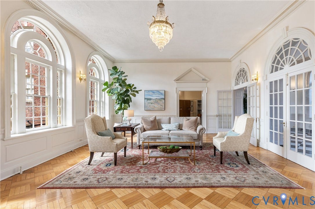 5621 Cary Street Road, #U4, Wilton, Richmond, VA 23226 Parquet wood-finish flooring, arched windows with multi-pane detailing, crown molding, crystal chandelier, and paneled glass double doors
