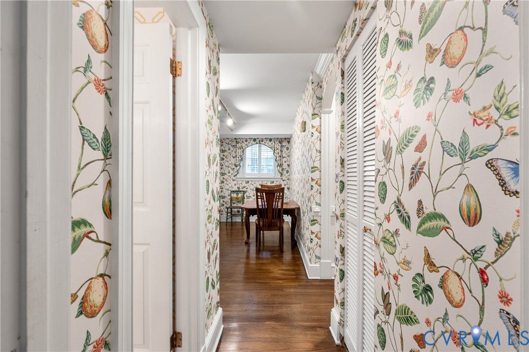 5621 Cary Street Road, #U4, Wilton, Richmond, VA 23226 Hallway featuring botanical-patterned wallpaper, wood-finish flooring, and white louvered doors