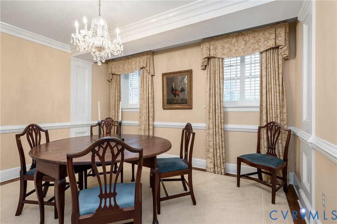 5621 Cary Street Road, #U4, Wilton, Richmond, VA 23226 Dining room featuring detailed crown molding, chair rail millwork, and a crystal chandelier