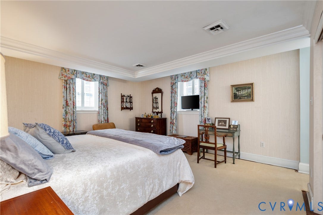 5621 Cary Street Road, #U4, Wilton, Richmond, VA 23226 Room featuring neutral wall covering, multi-tiered crown molding, recessed lighting, and dual windows