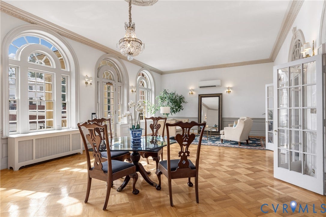 5621 Cary Street Road, #U4, Wilton, Richmond, VA 23226 Parquet wood flooring, arched floor-to-ceiling windows, elaborate crown molding, crystal chandelier, and paneled glass doors