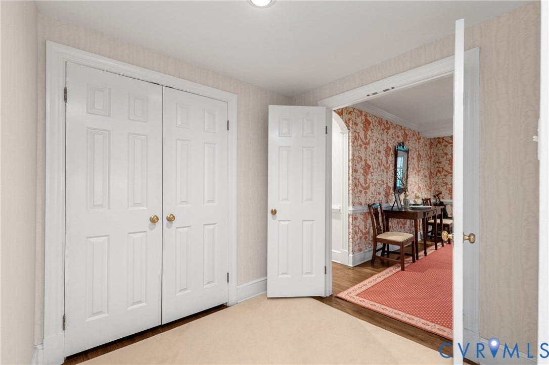 5621 Cary Street Road, #U4, Wilton, Richmond, VA 23226 Neutral-toned textured wallpaper, white six-panel interior doors, and crown molding