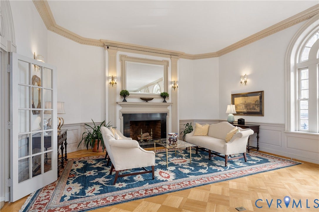 5621 Cary Street Road, #U4, Wilton, Richmond, VA 23226 Parquet wood-finish flooring, fireplace with classic millwork mantel, arched windows, intricate ceiling crown molding, and paneled wainscoting