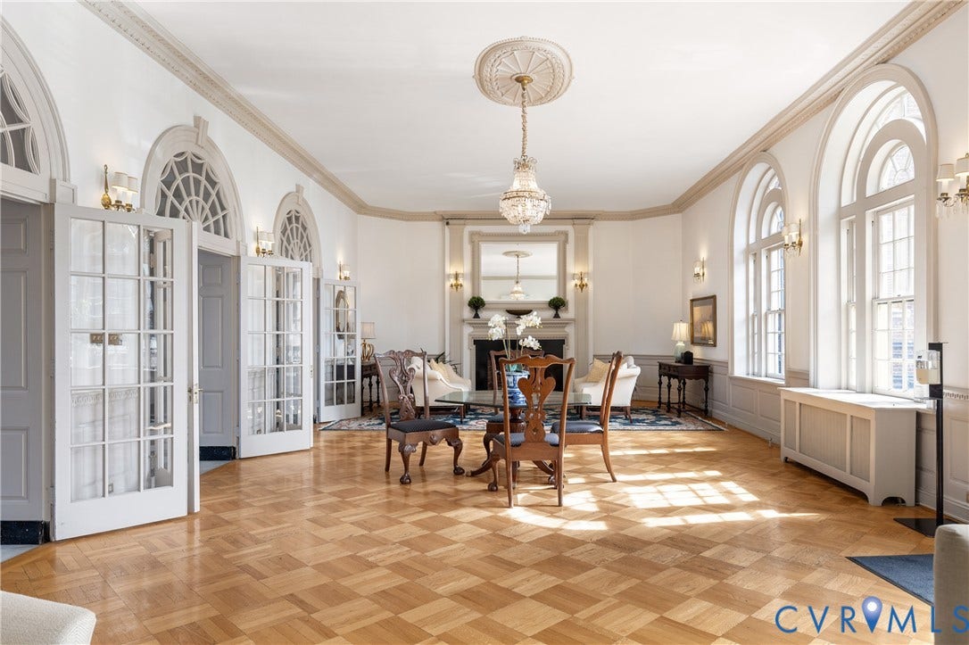 5621 Cary Street Road, #U4, Wilton, Richmond, VA 23226 Parquet hardwood flooring, arched windows with fanlight transoms, crown molding with ceiling medallions, multi-pane glass French doors, and a decorative fireplace mantel