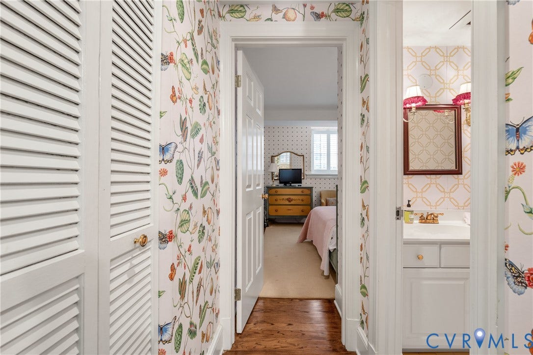 5621 Cary Street Road, #U4, Wilton, Richmond, VA 23226 Hallway featuring wood-finish flooring, white louvered closet doors, and patterned wall coverings