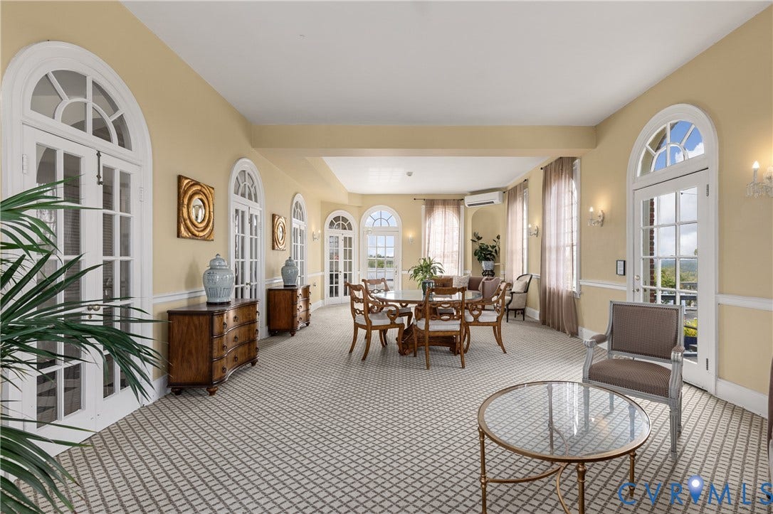 5621 Cary Street Road, #U4, Wilton, Richmond, VA 23226 Sunroom featuring arched French doors, patterned carpeting, wall-mounted lighting, and chair rail molding