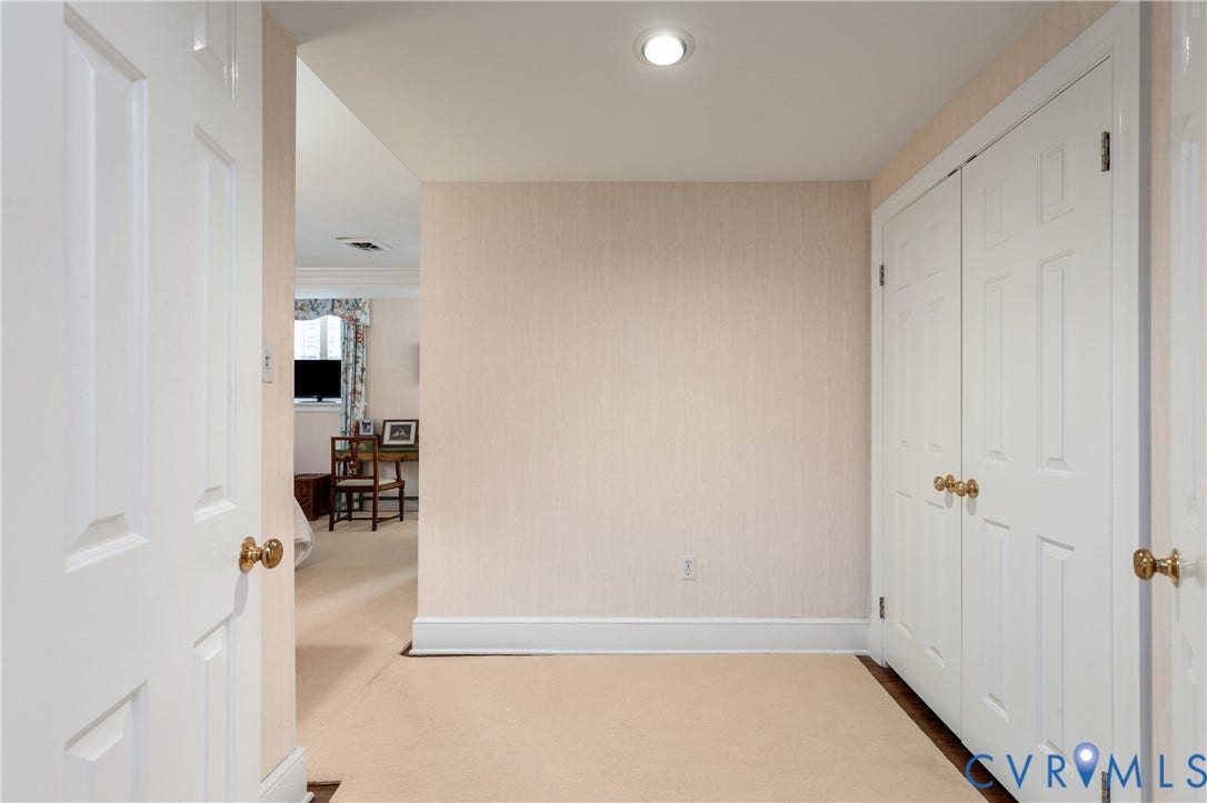 5621 Cary Street Road, #U4, Wilton, Richmond, VA 23226 Neutral-toned wallpaper, recessed ceiling lighting, and double-door closet with brass-finish hardware