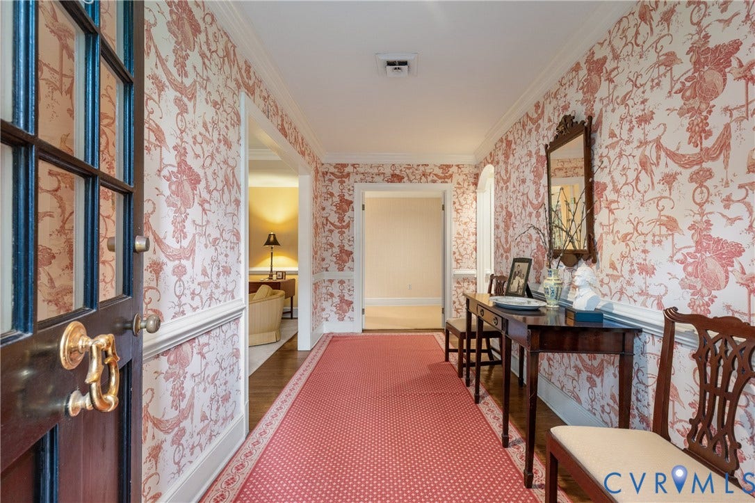 5621 Cary Street Road, #U4, Wilton, Richmond, VA 23226 Foyer featuring patterned wall coverings, wainscoting, crown molding, wood-finish flooring, and a multi-pane glass-inlay door with polished brass hardware