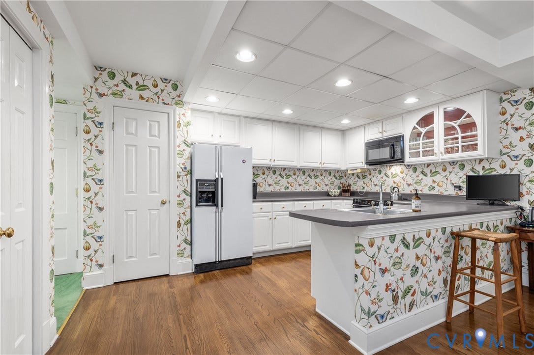 5621 Cary Street Road, #U4, Wilton, Richmond, VA 23226 Kitchen featuring white cabinetry, solid-surface countertops, wood-finish flooring, recessed lighting, and upper cabinets with glass-paneled doors