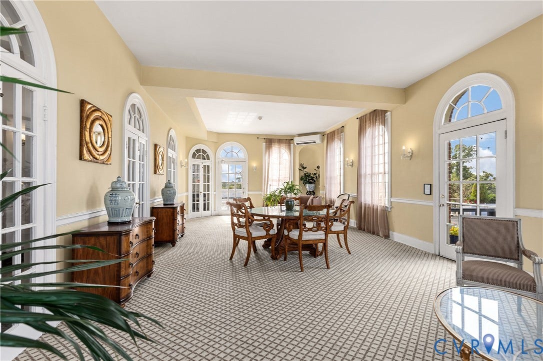 5621 Cary Street Road, #U4, Wilton, Richmond, VA 23226 Expansive room featuring multiple arched glass-paned entry doors, chair rail molding, and high-reaching ceilings