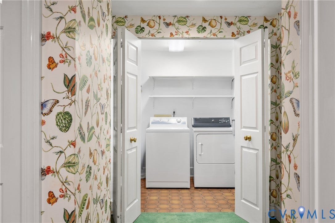 5621 Cary Street Road, #U4, Wilton, Richmond, VA 23226 Laundry closet featuring dual white bi-fold doors, botanical print wallpaper, hexagonal tile flooring, and integrated wall-mounted shelving