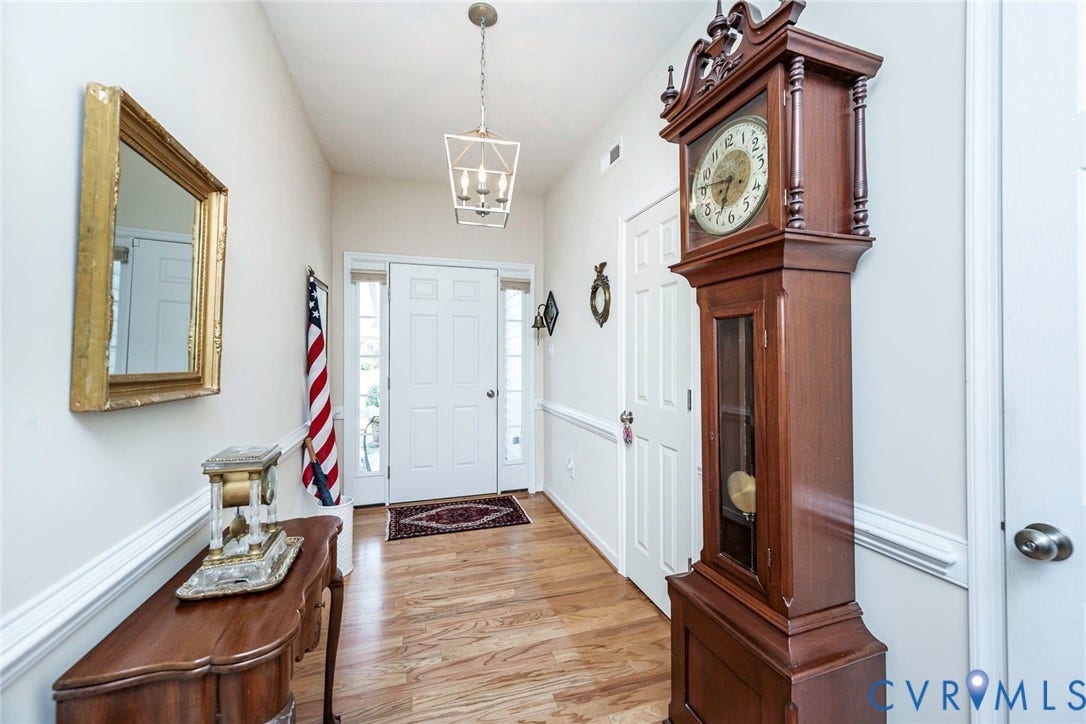 Entry foyer with half bath to the right