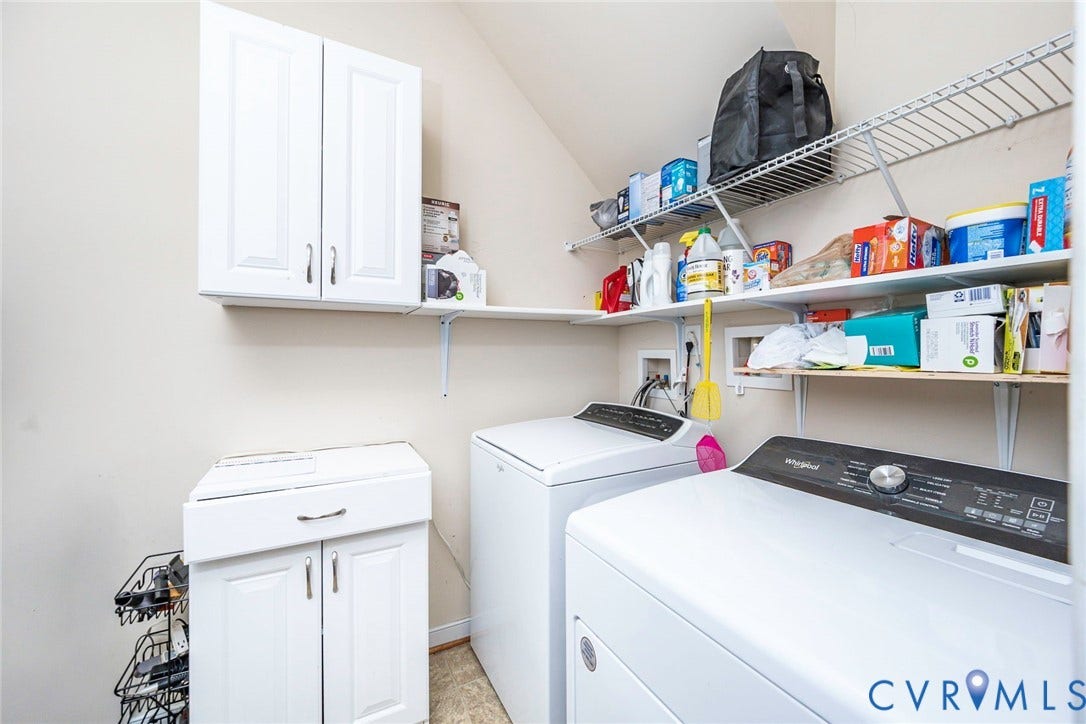 Laundry room with shelving and storage
