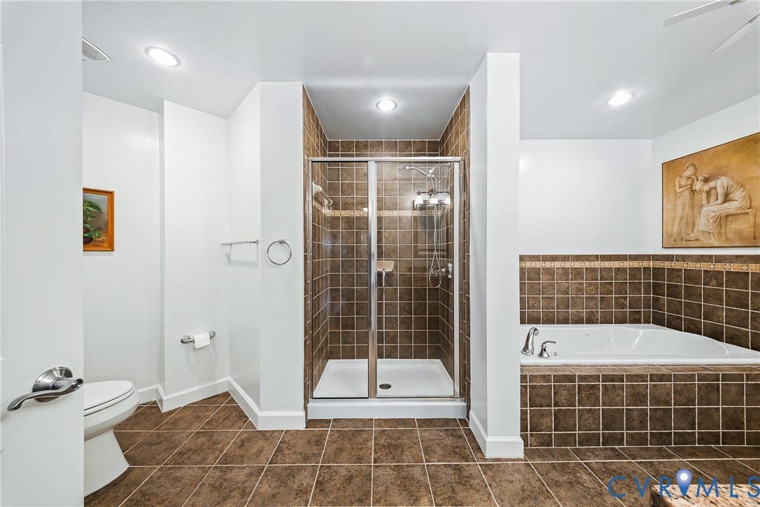 4820 Old Main Street, #503, Sky Line Condo, Richmond, VA 23231 Spacious bathroom featuring a built-in jetted tub, a separate tiled shower with glass enclosure, and recessed lighting