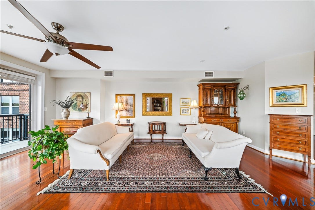 4820 Old Main Street, #503, Sky Line Condo, Richmond, VA 23231 Hardwood flooring throughout, a ceiling fan with integrated lighting, and a private balcony