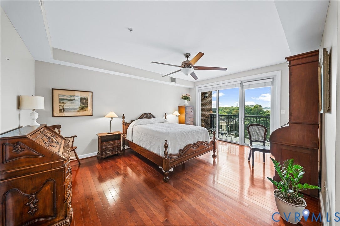 4820 Old Main Street, #503, Sky Line Condo, Richmond, VA 23231 Hardwood flooring, recessed ceiling, ceiling fan, sliding glass door, and balcony with railing