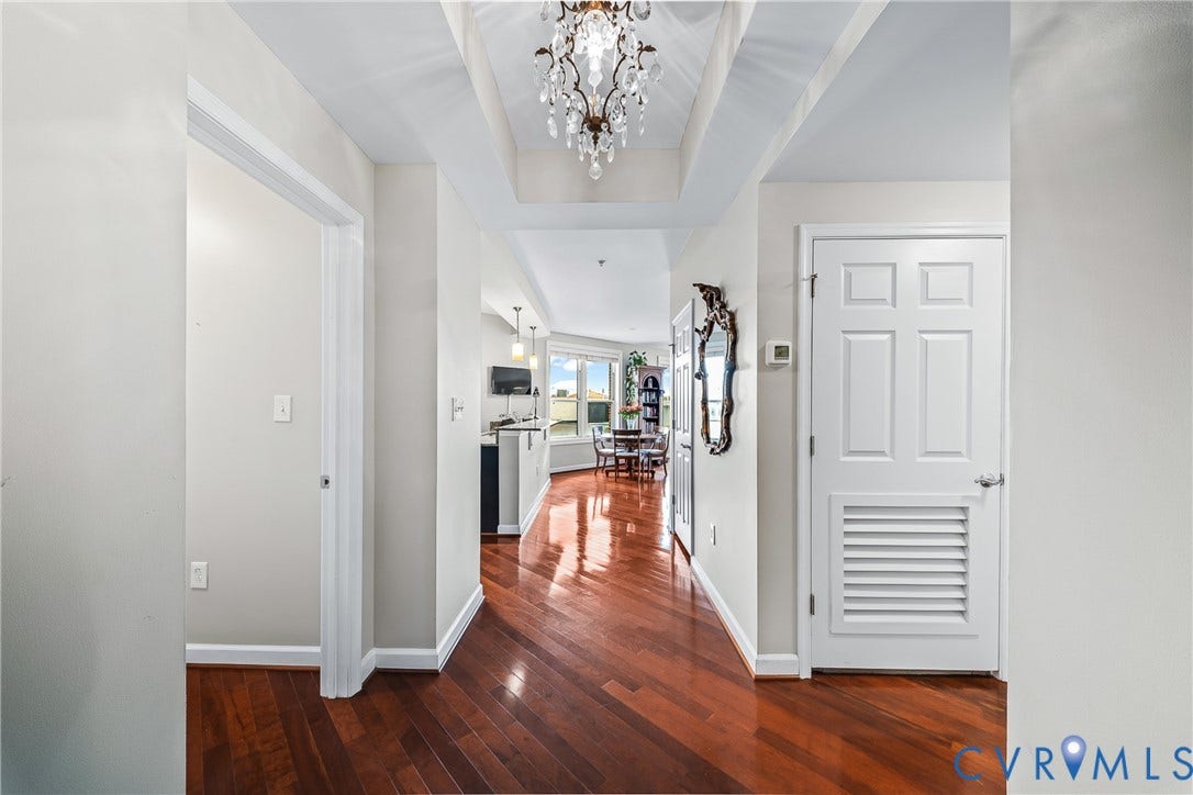 4820 Old Main Street, #503, Sky Line Condo, Richmond, VA 23231 Wood-finish flooring, recessed ceiling design, and a crystal chandelier