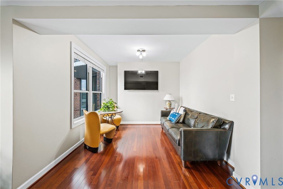 4820 Old Main Street, #503, Sky Line Condo, Richmond, VA 23231 Hardwood-style flooring throughout, dual windows with white trim, and a ceiling-mounted lighting fixture