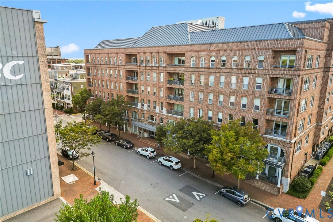 4820 Old Main Street, #503, Sky Line Condo, Richmond, VA 23231 Brick facade building featuring multiple balconies