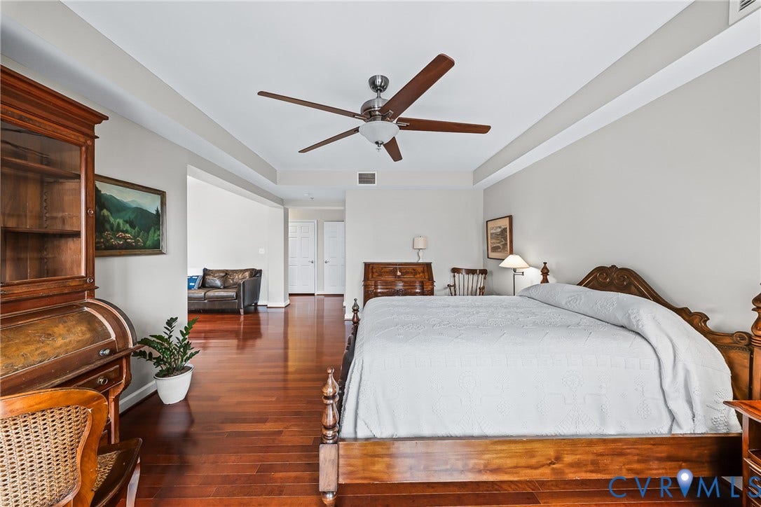 4820 Old Main Street, #503, Sky Line Condo, Richmond, VA 23231 Hardwood flooring, recessed lighting, ceiling fan, crown molding, and white paneled doors