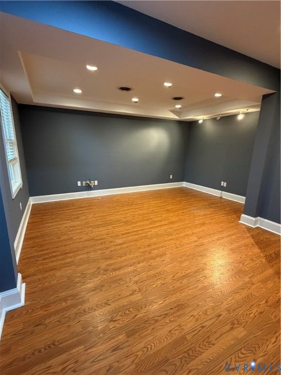 6323 Mallory Drive, Richmond, VA 23226 Recessed lighting, tray ceiling, dark accent walls, wood-finish flooring, and white trim
