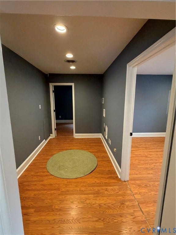 6323 Mallory Drive, Richmond, VA 23226 Recessed ceiling lighting, wood-finish flooring, white trim, and a dark wall finish