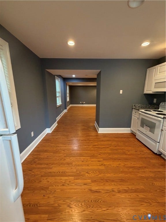 6323 Mallory Drive, Richmond, VA 23226 Hardwood flooring throughout, recessed ceiling lighting, white cabinetry, and a white range