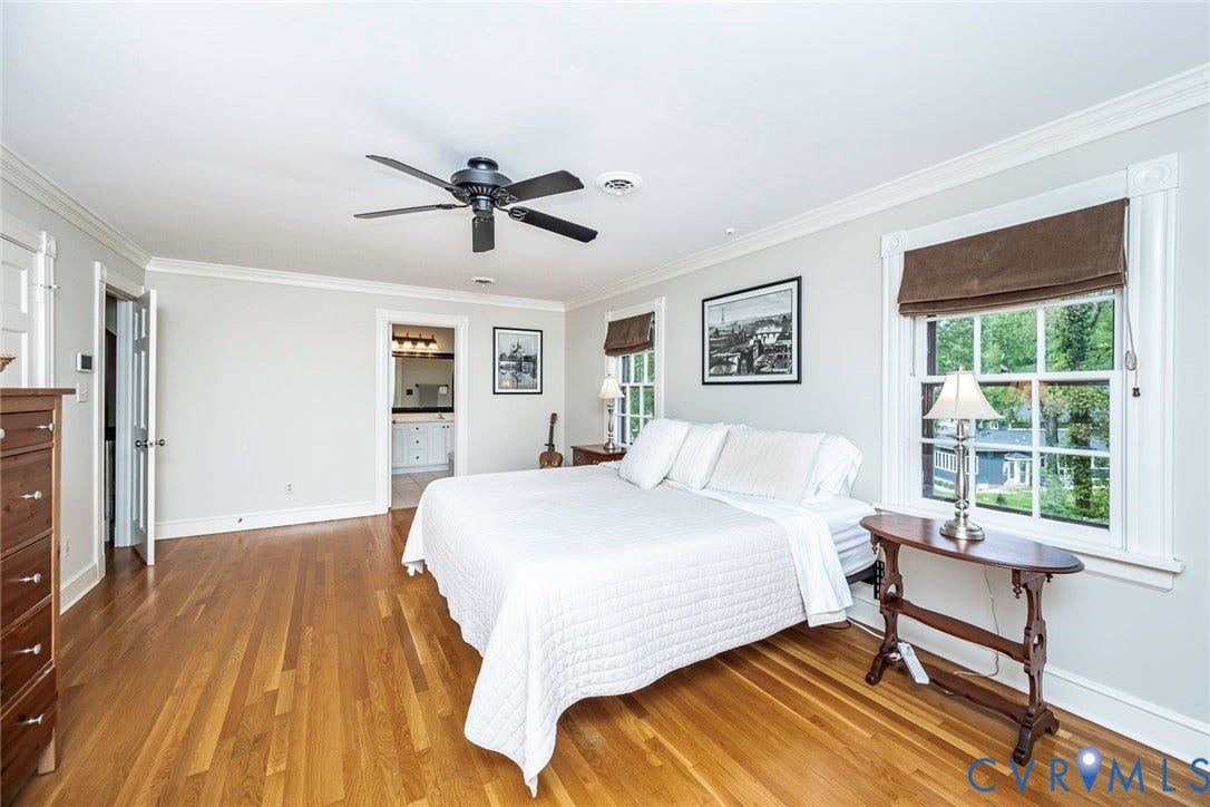 Hardwood flooring, crown molding, double windows, ceiling fan, and en-suite access