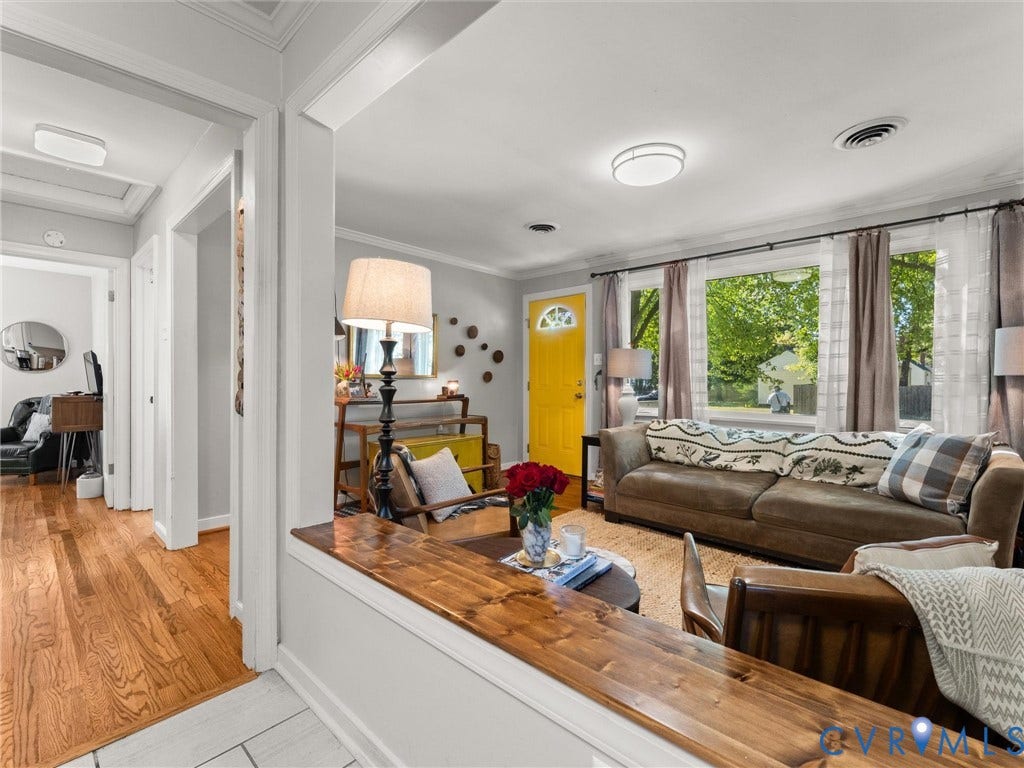 3933 Alma Avenue, Richmond, VA 23222 Living area featuring wide plank wood-finish flooring, recessed lighting, and a bright yellow entry door