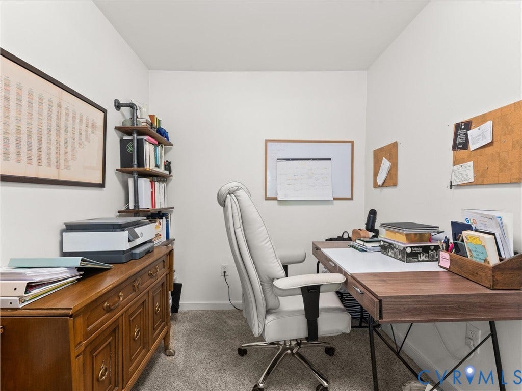 3933 Alma Avenue, Richmond, VA 23222 Neutral wall paint, built-in shelving, wall-mounted whiteboard, and carpeted flooring