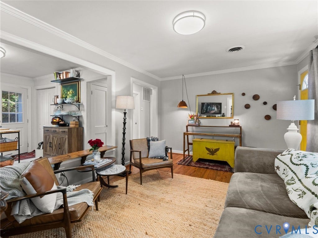 3933 Alma Avenue, Richmond, VA 23222 Hardwood flooring, crown molding, cased openings, and a built-in wall shelf system