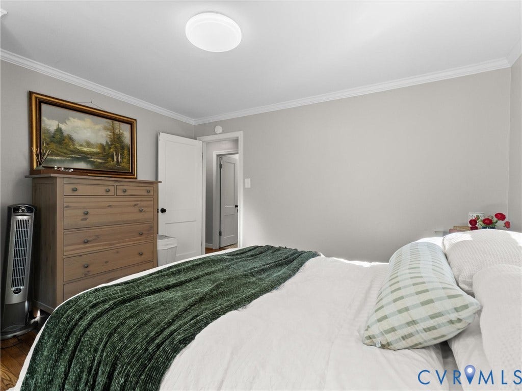 3933 Alma Avenue, Richmond, VA 23222 Crown molding, a flush-mount ceiling light fixture, and a solid wood dresser with multiple drawers