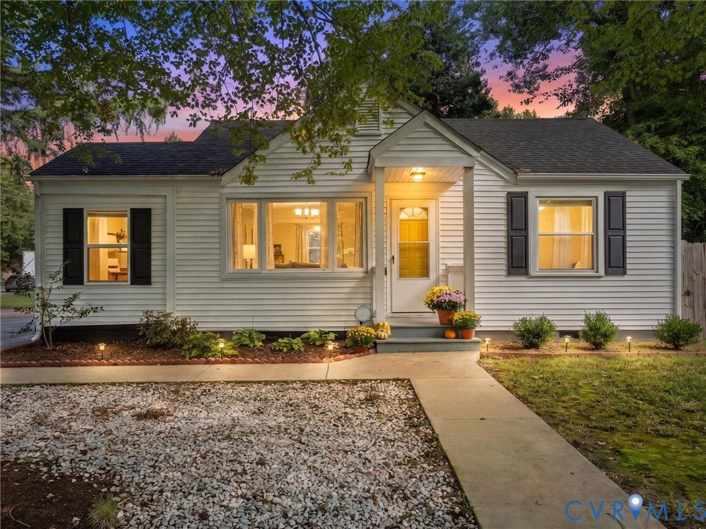 3933 Alma Avenue, Richmond, VA 23222 White siding exterior with dark shutters, covered entry, and multiple windows