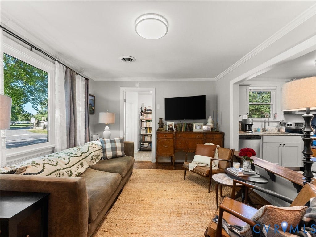 3933 Alma Avenue, Richmond, VA 23222 Bright living area featuring a large window, light gray walls, and recessed lighting