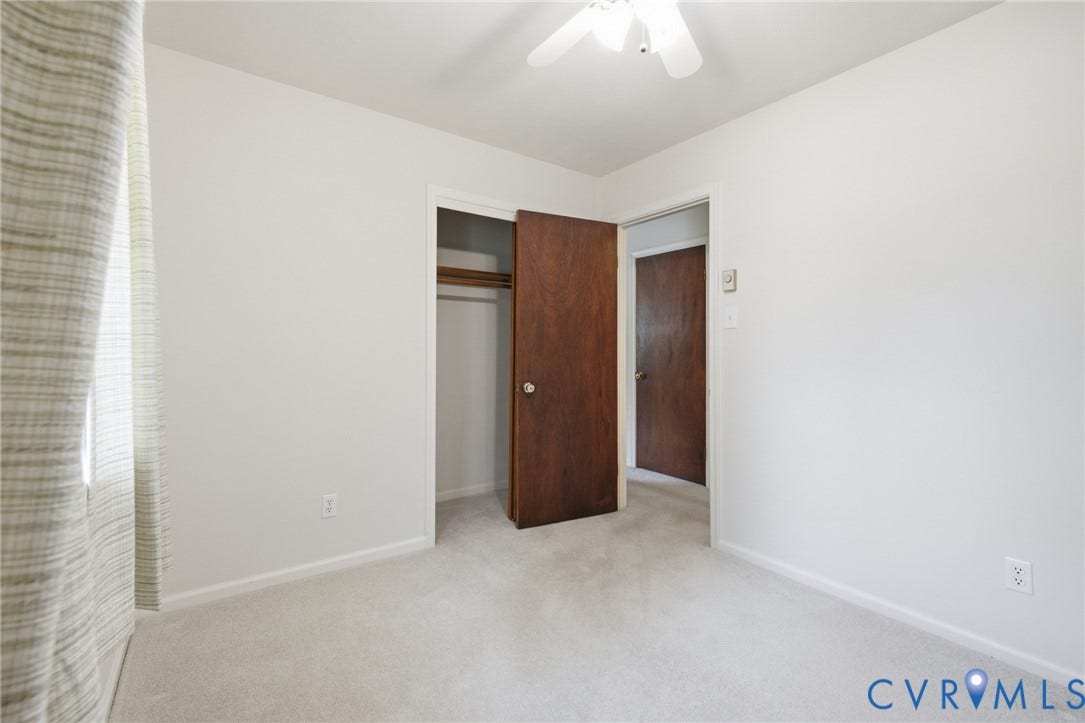 10215 River Road, South Chesterfield, VA 23803 Light-toned carpeting, white painted walls, and a ceiling fan
