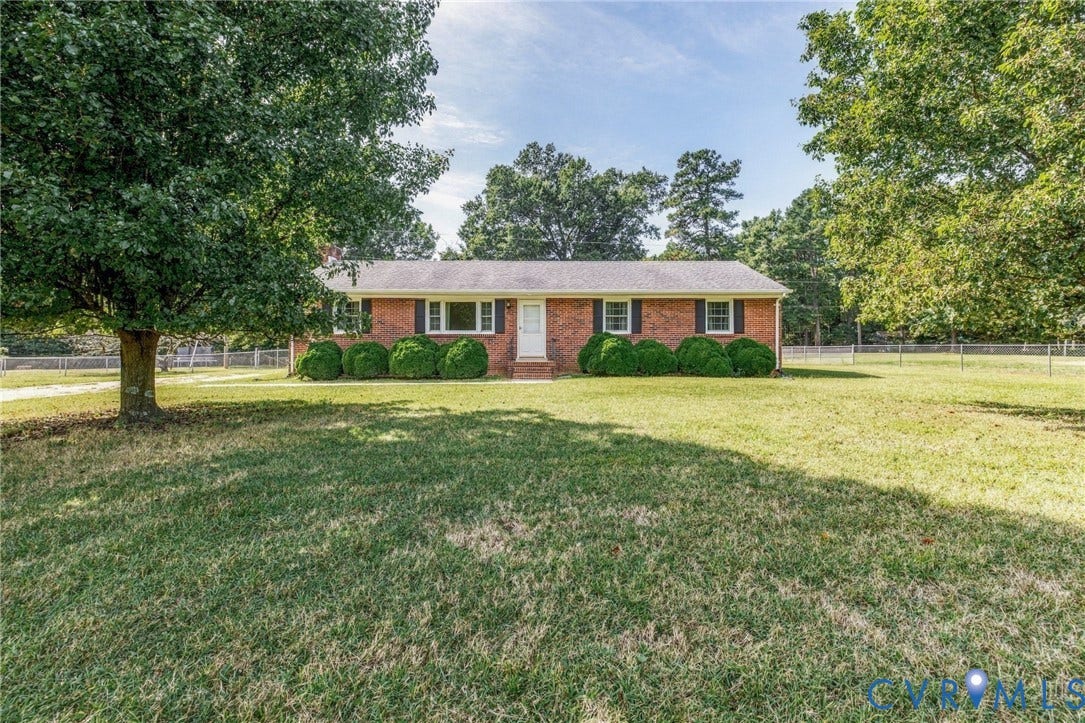 10215 River Road, South Chesterfield, VA 23803 Brick exterior with white front door, white window trim, and dark shutters