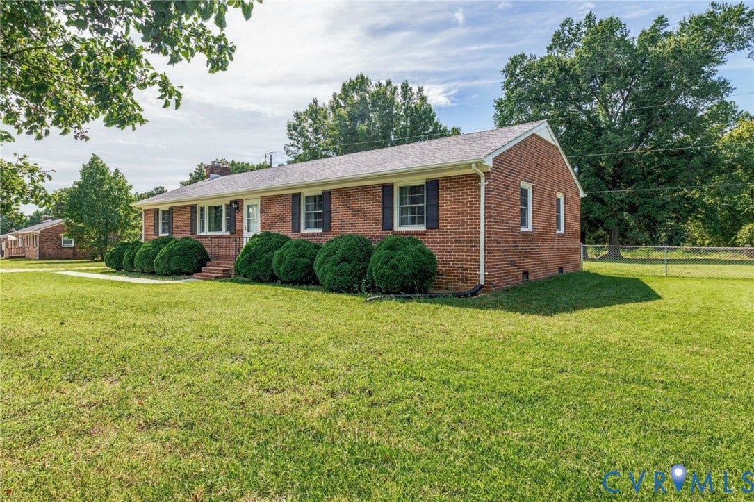 10215 River Road, South Chesterfield, VA 23803 Brick exterior with white trim, black shutters, and a front entry