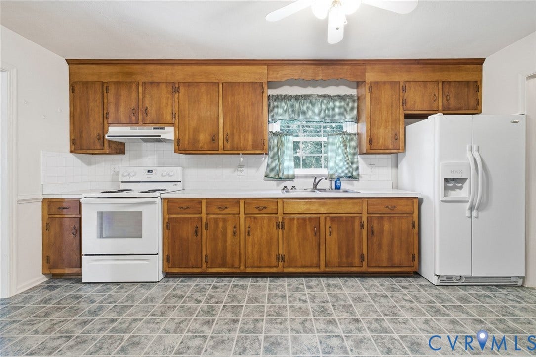 10215 River Road, South Chesterfield, VA 23803 Kitchen featuring wood cabinetry, white appliances, a white subway tile backsplash, white countertops, and a ceiling fan