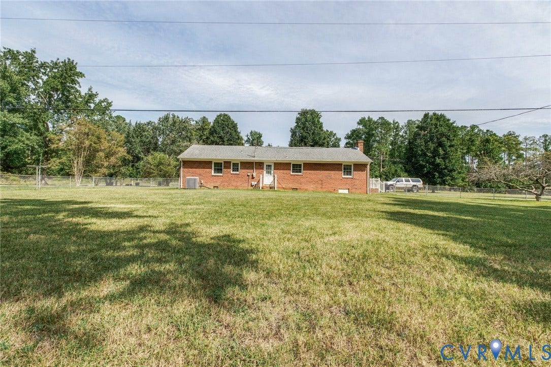 10215 River Road, South Chesterfield, VA 23803 Expansive rear yard with a brick exterior dwelling and mature perimeter trees