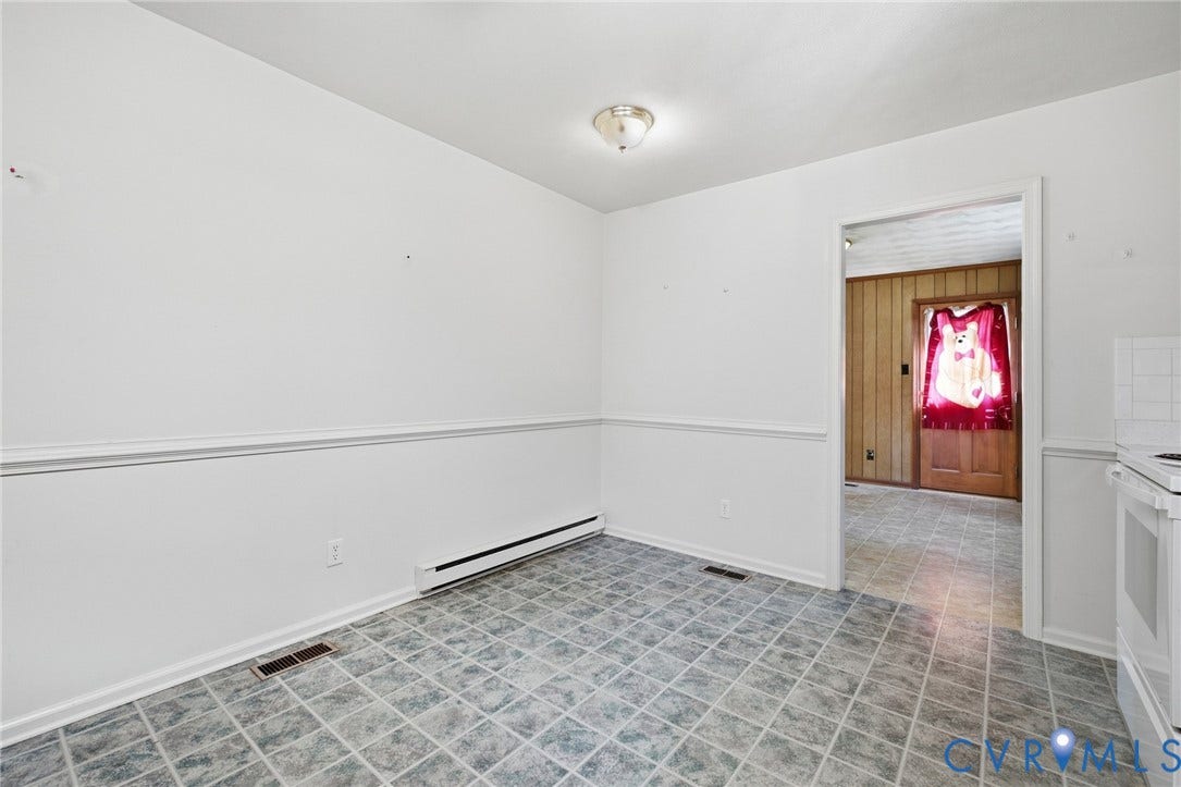 10215 River Road, South Chesterfield, VA 23803 Tiled flooring, chair rail molding, ceiling-mounted light fixture, and paneled walls