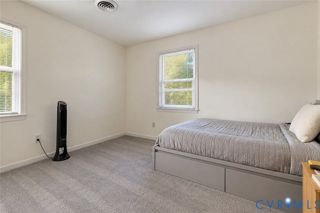 12308 Poplar Forest Drive, Tuckahoe Village, Henrico, VA 23238 Neutral wall paint, two windows with blinds, gray carpeting, and an overhead ventilation system