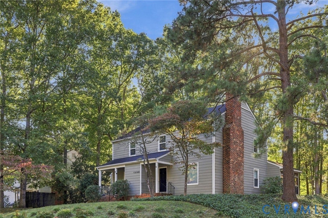 12308 Poplar Forest Drive, Tuckahoe Village, Henrico, VA 23238 Two-story residence with gray siding, brick chimney, covered porch, and mature trees