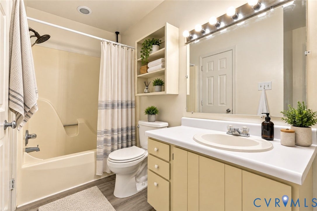 12308 Poplar Forest Drive, Tuckahoe Village, Henrico, VA 23238 Bathroom featuring a vanity with a laminate countertop, integrated sink, and chrome faucet