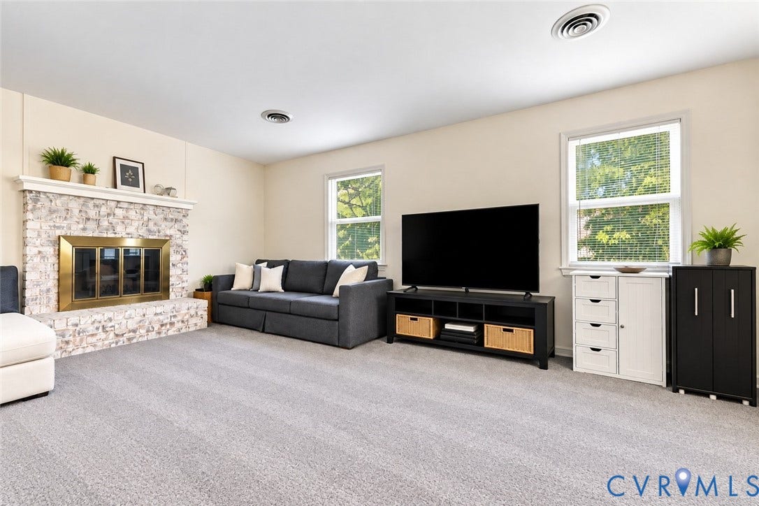 12308 Poplar Forest Drive, Tuckahoe Village, Henrico, VA 23238 Stone-clad fireplace with a brass firebox, light-toned walls, and recessed lighting