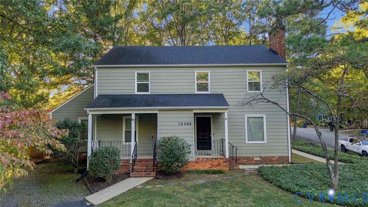 12308 Poplar Forest Drive, Tuckahoe Village, Henrico, VA 23238 Two-story residence featuring siding exterior, front porch with black railing, brick foundation, and a prominent brick chimney