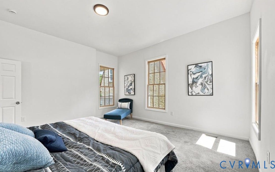 104 E Fillmore Street, Petersburg, VA 23803 Recessed lighting, wood-trimmed windows, neutral wall tones, and gray carpeting
